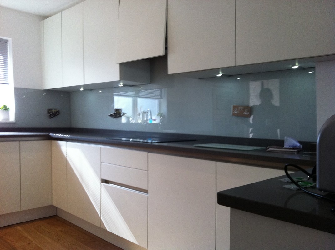 Grey glass kitchen splashback with LED lighting in Northolt