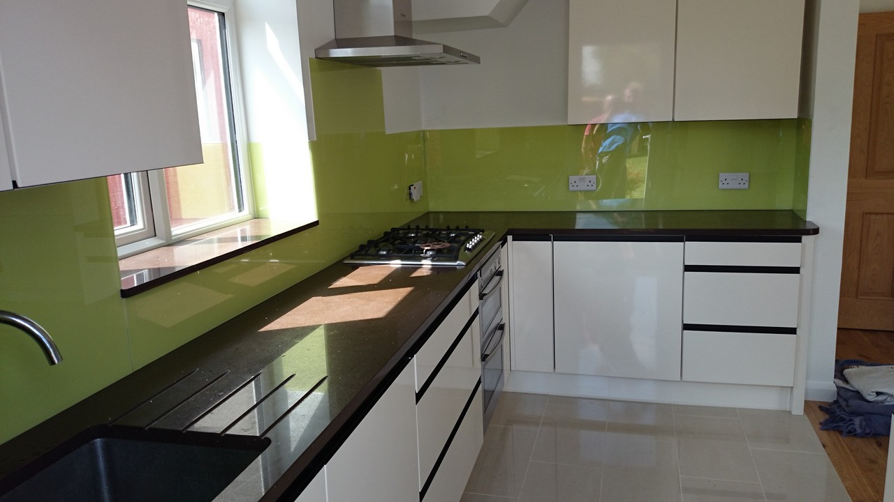 Lime green glass kitchen splashback installed by Northolt glaziers
