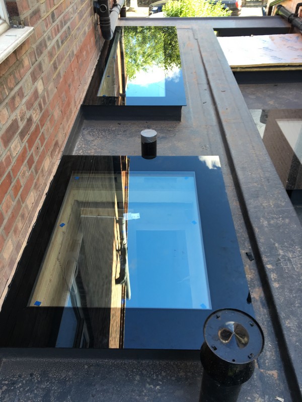 Multiple flat roof skylights on extension in Northolt