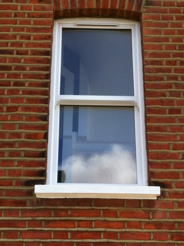 uPVC sash window on Victorian red brick house in Northolt